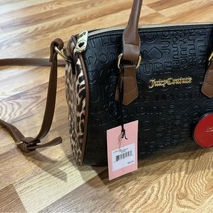 NWT. Juicy Couture Black satchel w/red heart charm. Leopard print on both sides